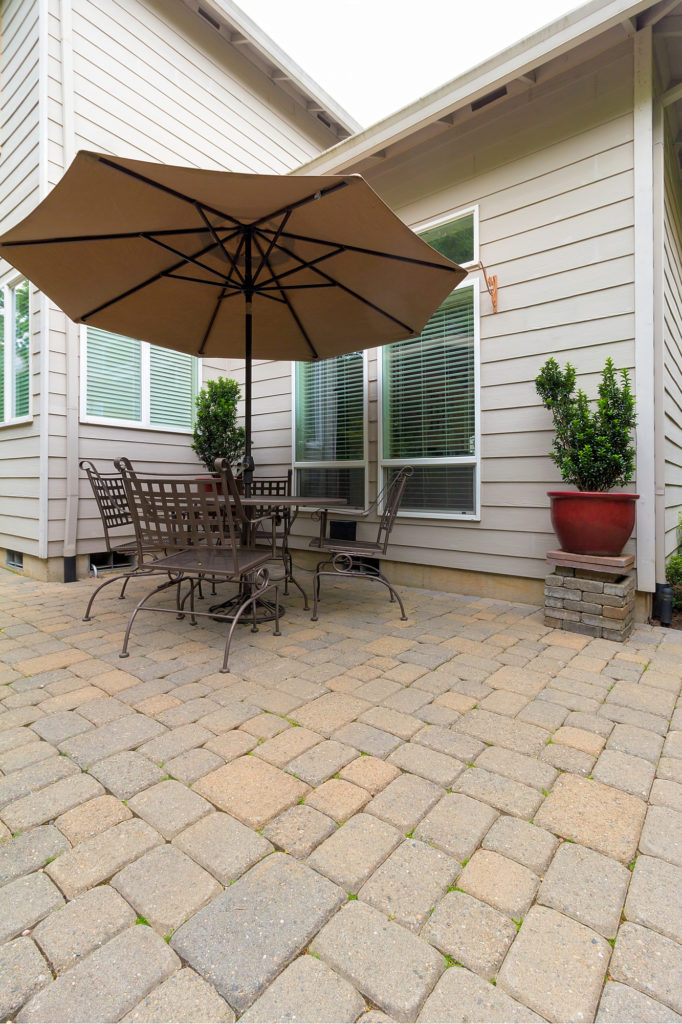 pavers in backyard with lawn furniture